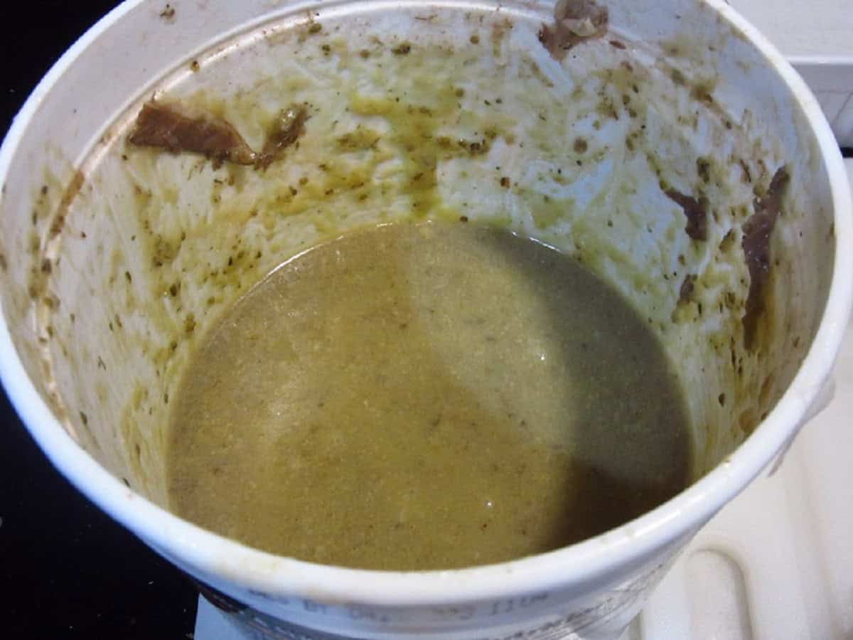 The juice remaining in a plastic tub after the beef has been taken out.