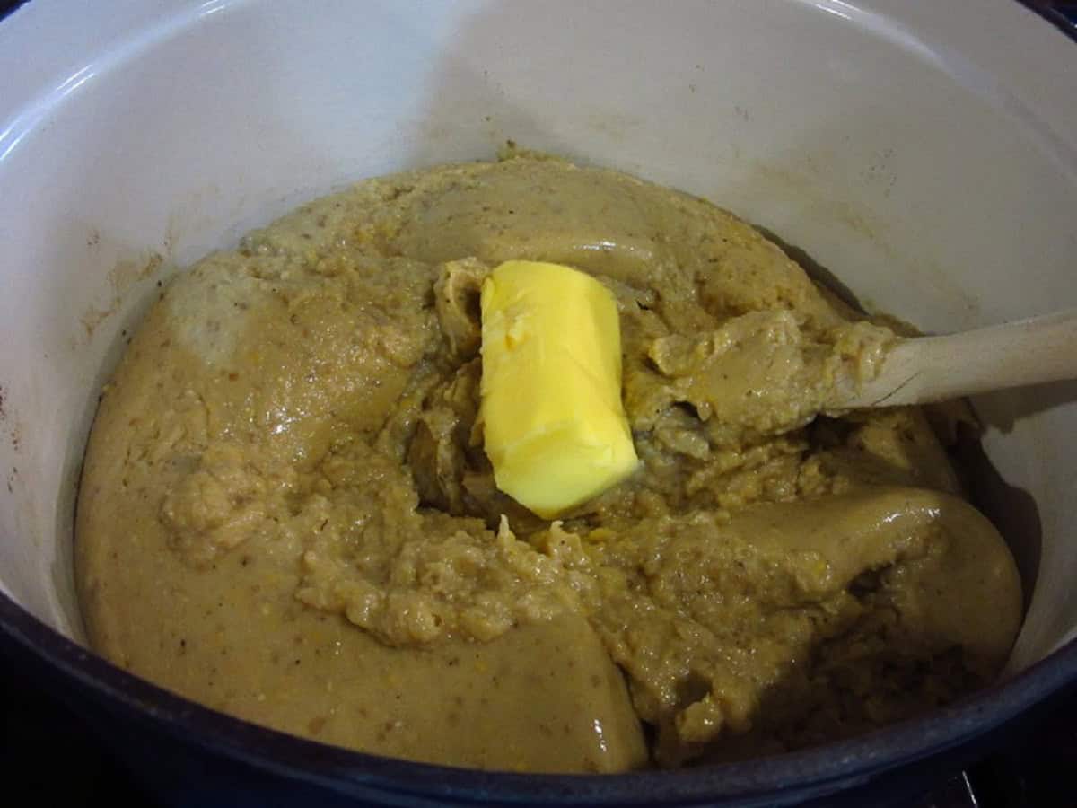 Butter in a thick mess of corn chowder in a Dutch oven.