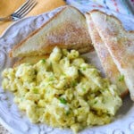 A pile of fluffy yellow scrambled eggs made in an air fryer.