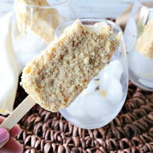 A hand holding a copycat keto-friendly Toasted Almond Ice Cream Bar
