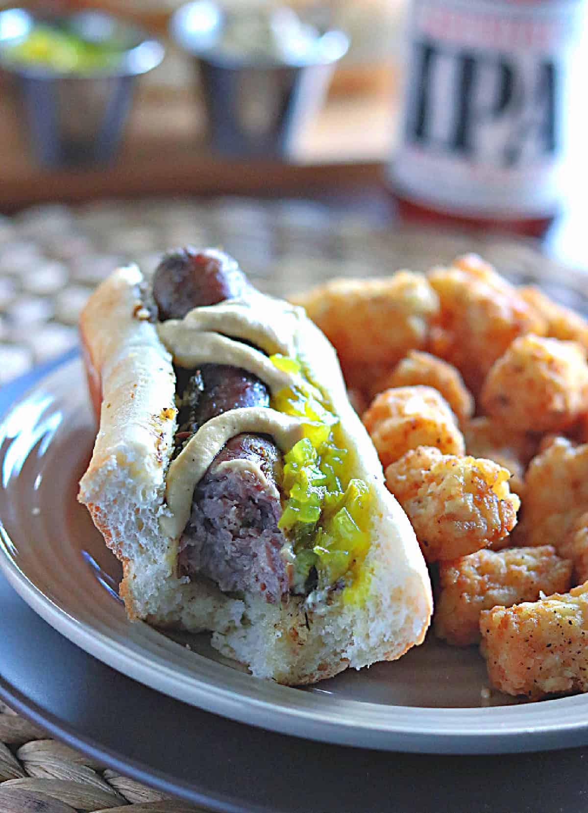 A beer braised bratwurst with a bit taken out.