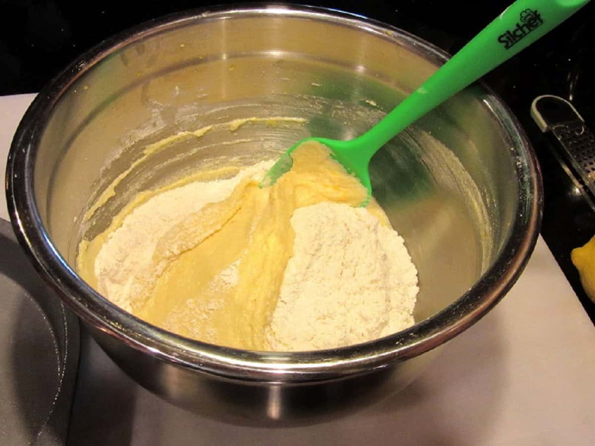 Flour and the lemon ricotta mixture in a large bowl.