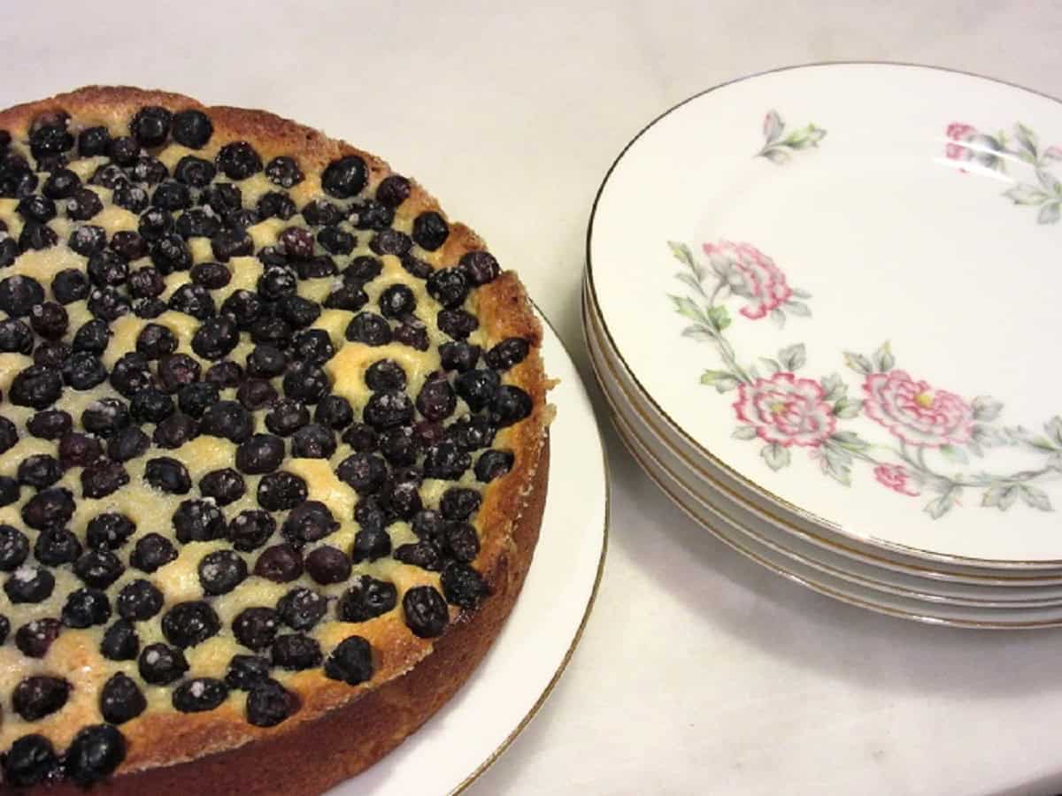 A baked lemon ricotta cake before slicing.