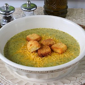 Golden croutons in a bowl of green Roasted Broccoli Cheddar Soup.