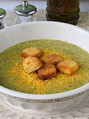 Golden croutons in a bowl of green Roasted Broccoli Cheddar Soup.