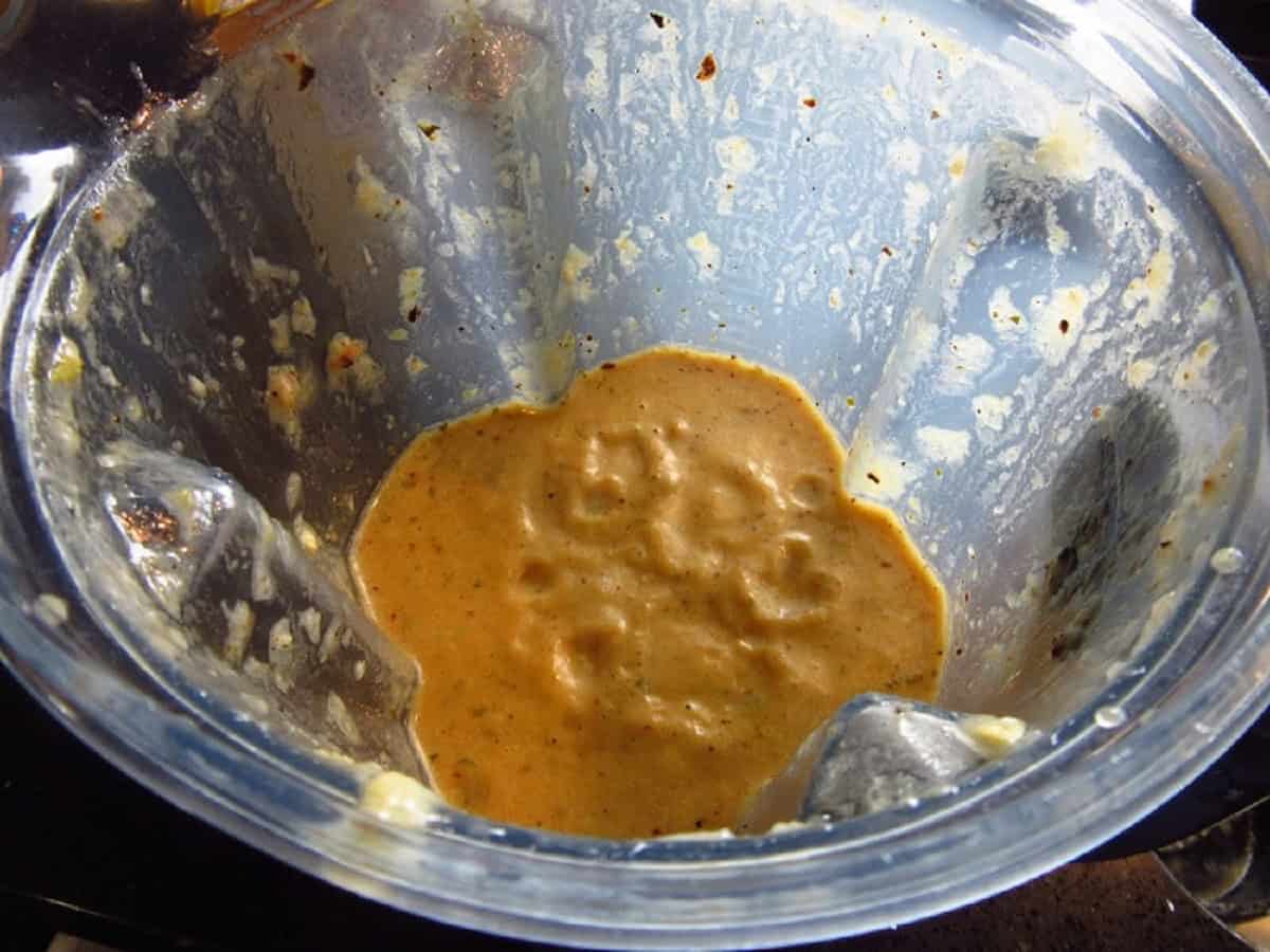 An ugly creamy vegetable soup in a blender.