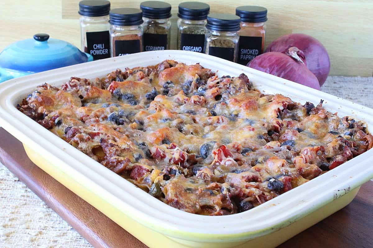 A yellow casserole dish filled with Turkey Taco Lasagna.