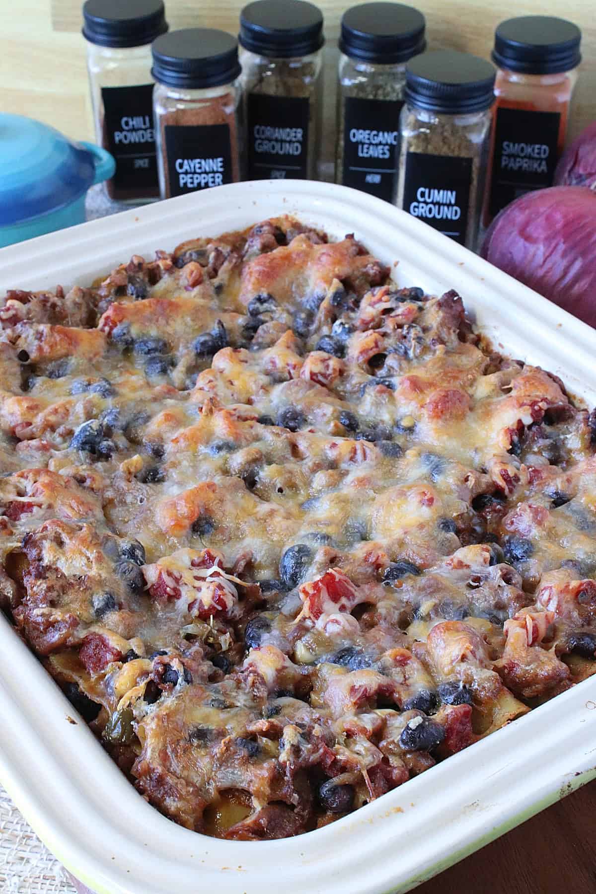 A casserole dish filled with cheesy Turkey Taco Lasagna.
