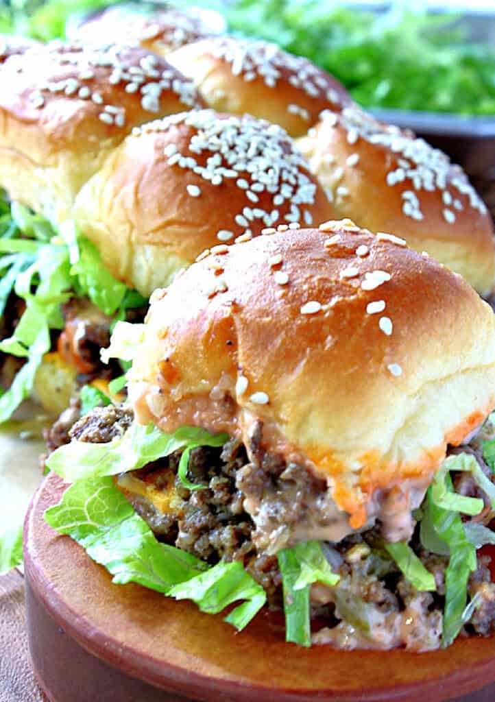 Ground beef Big Mac Sliders with special sauce and shredded lettuce.