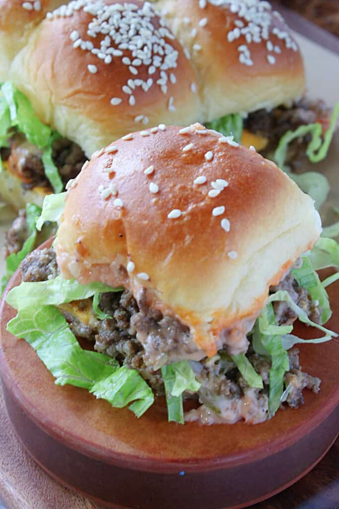 A single Big Mac Slider on a wooden pedestal.