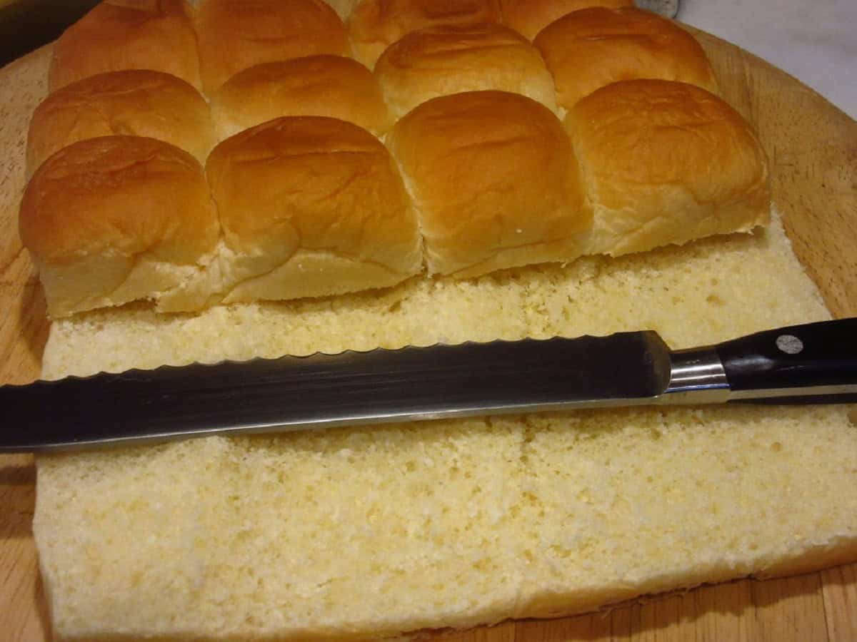 Sliced rolls with a serrated knife for making big mac sliders.