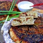 Two pretty slices of Chinese Bing Bread filled with bacon, scallions, and potatoes.