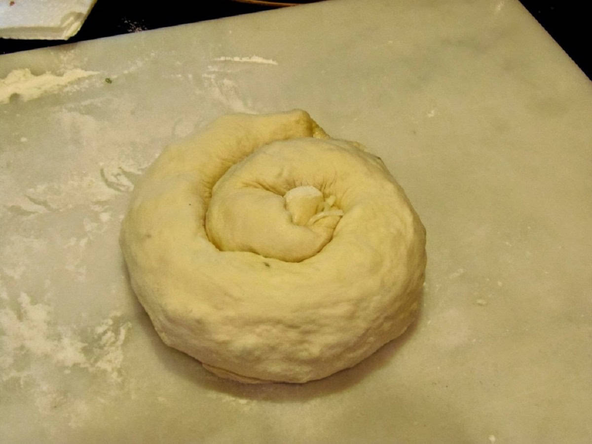 A coil of Chinese Bring bread before flattening.
