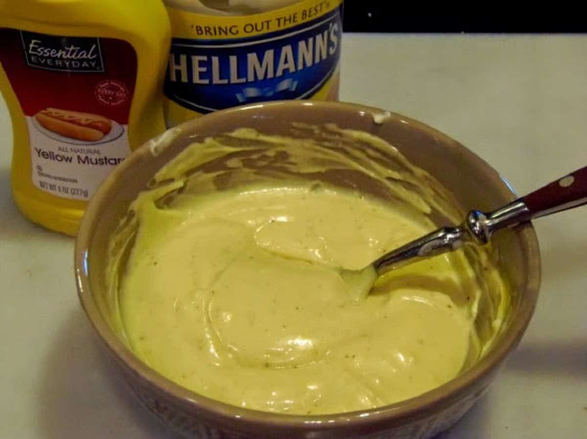 A mustard and may sauce in a bowl.