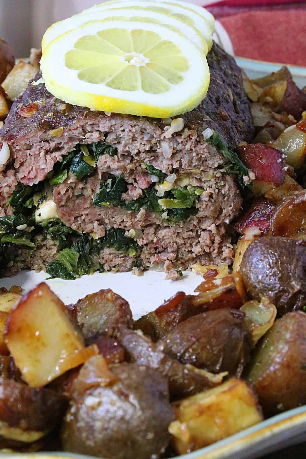 A beautiful spiral stuffed Greek Meatloaf with Spinach and Feta.