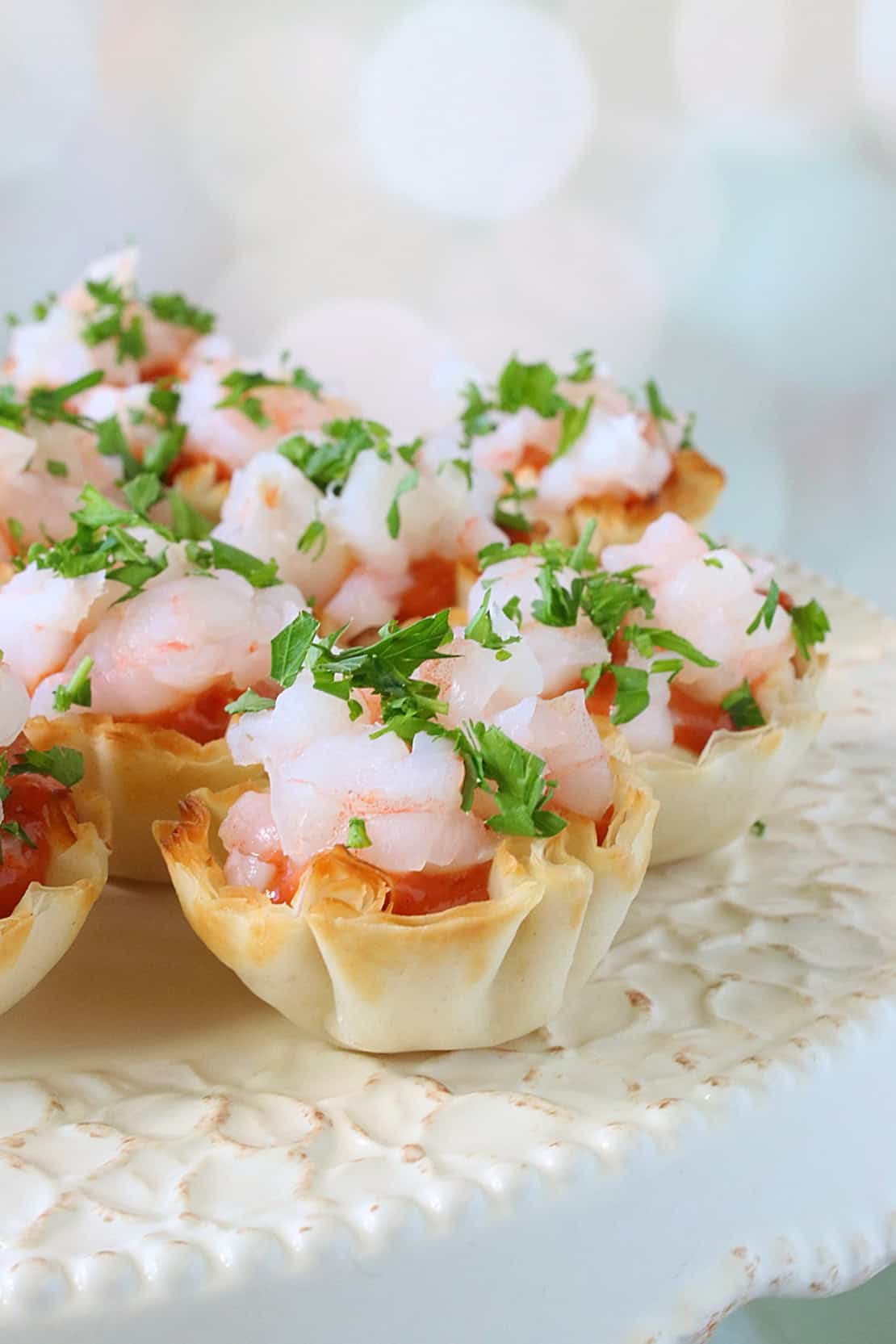 A closeup of a shrimp cocktail appetizer in a phyllo shell.