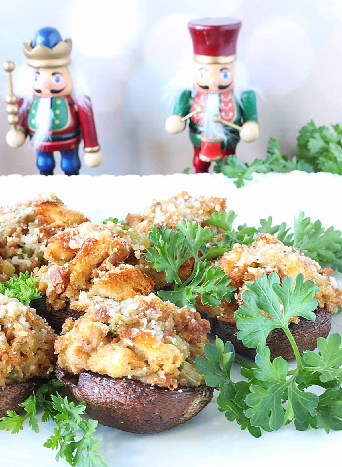 Stuffing stuffed brown mushroom caps surrounded by parsley on a platter.