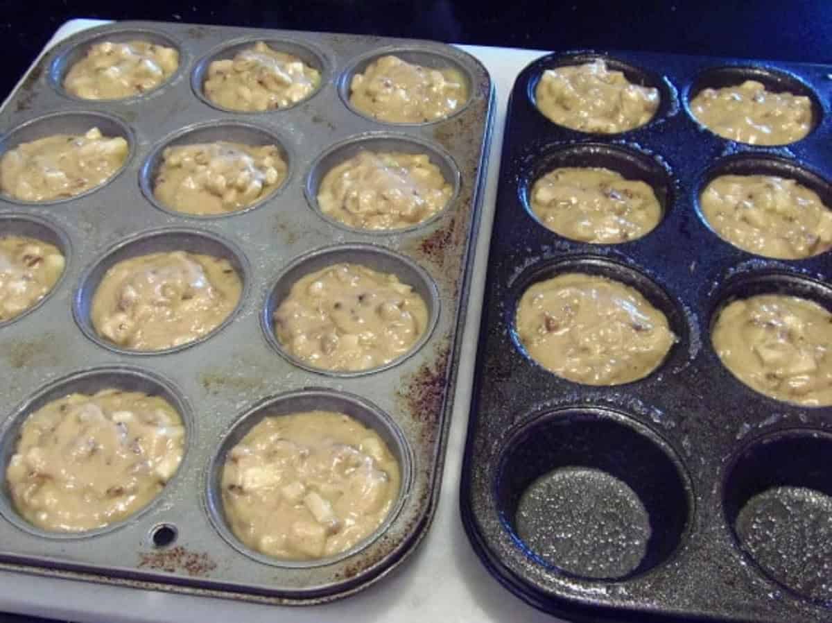 Caramel apple cupcake batter inside of muffin tins before baking.