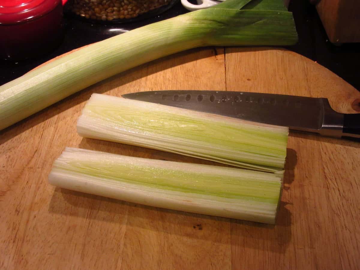 A cross section of the layers of a leek on a cutting board.
