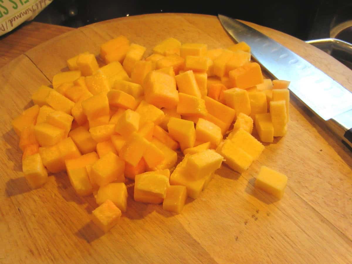 Cubed butternut squash on a cutting board.