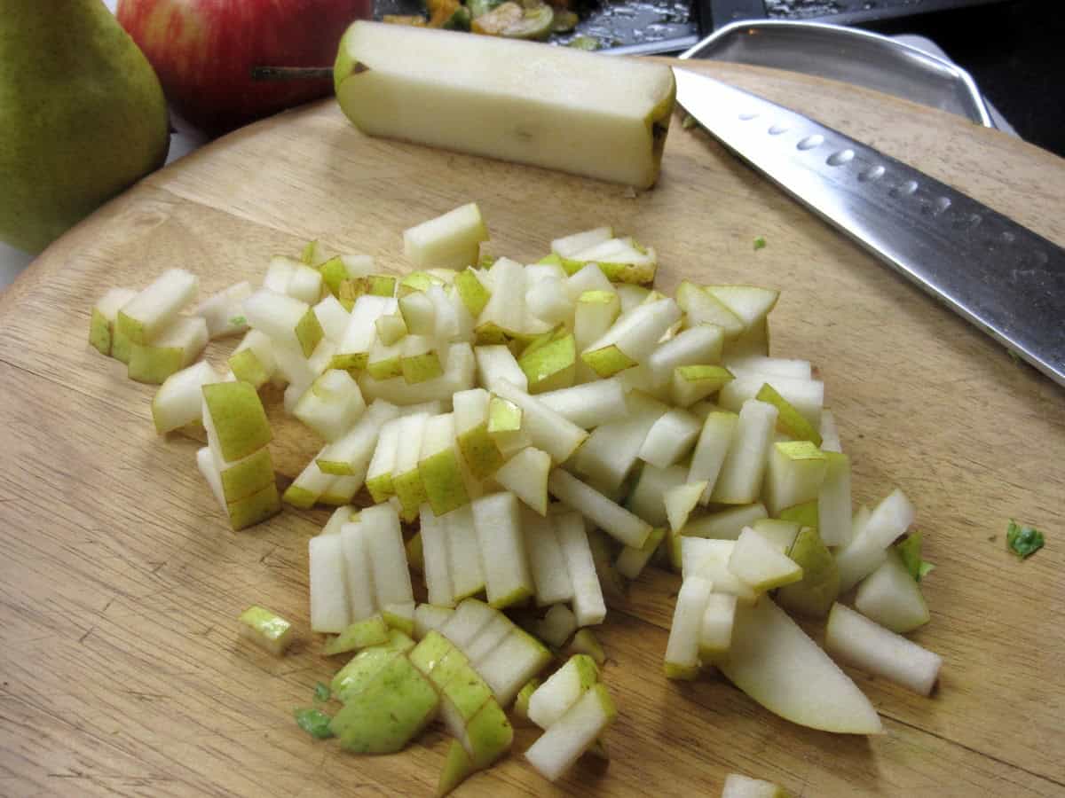 Diced pears on a cutting board.
