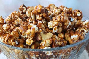 A yummy looking bowl filled with Caramel Corn with Bacon and Cashews.