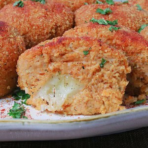 Melted cheese on the inside of a mashed sweet potato croquette.