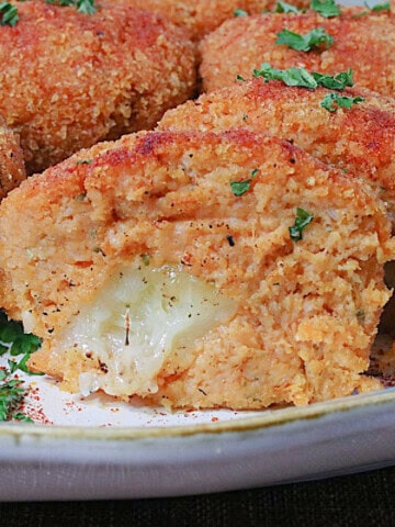 Melted cheese on the inside of a mashed sweet potato croquette.