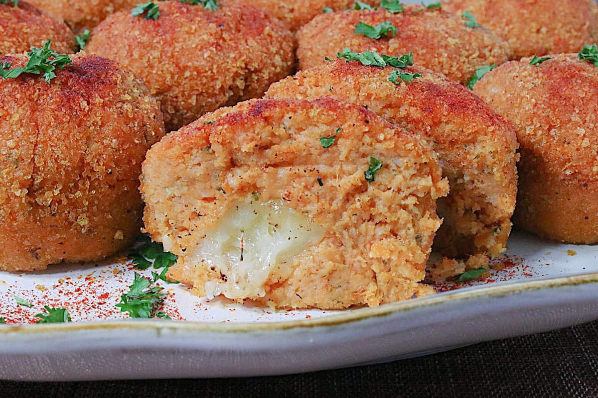 The inside of a Mashed Sweet Potato Croquette with melted cheese.
