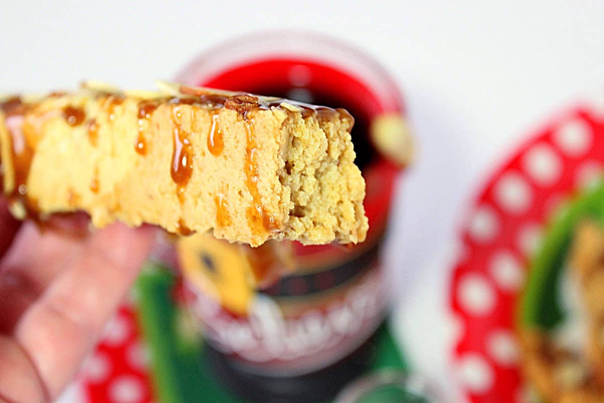 The inside of a amaretto coconut biscotti cookie after a bite has been taken.