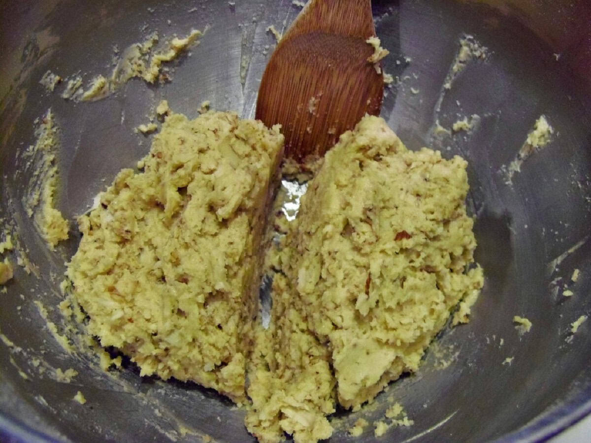 A amaretto coconut biscotti dough in a mixing bowl.