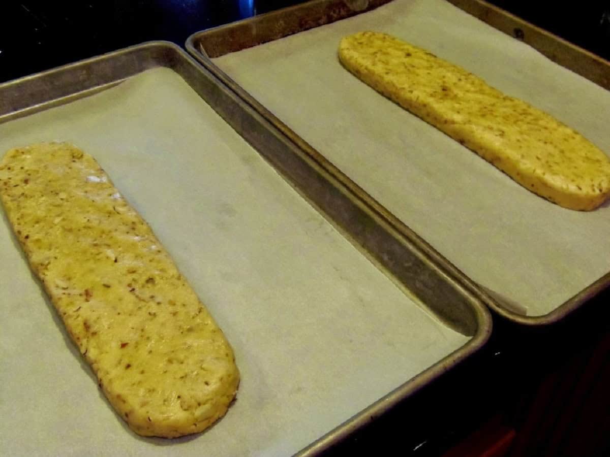 Two flattened logs of biscotti before baking.