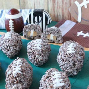 The inside of a caramel cream stuffed cocoa krispies football shaped treat.