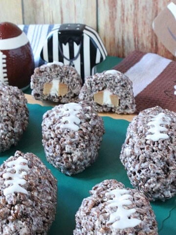 The inside of a caramel cream stuffed cocoa krispies football shaped treat.