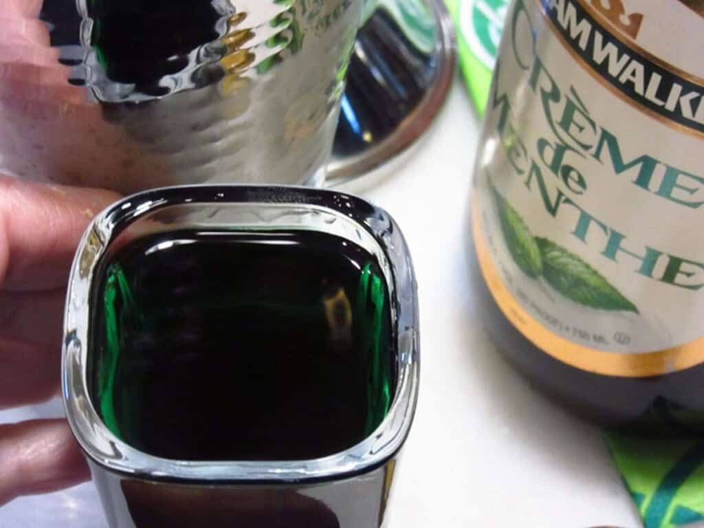 Creme de menthe in a shot glass.