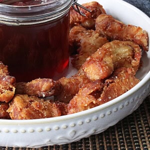 Golden brown Japanese Fried Chicken Nuggets in a white bowl.