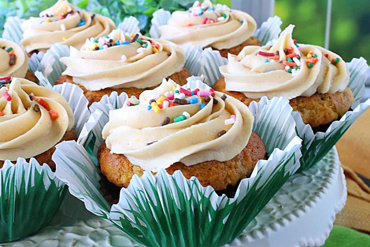 A beautiful swirl of buttercream frosting on top of a cupcake.