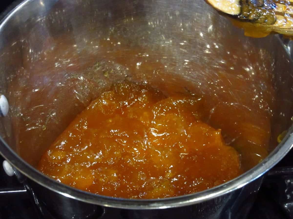 Apricot jam in a saucepan.