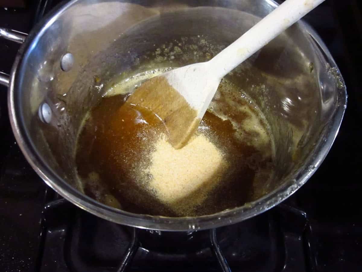 Garlic powder in a saucepan with glaze.