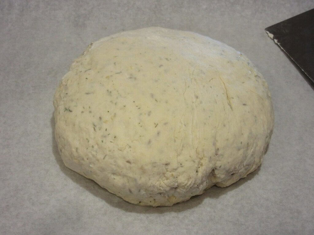 A round loaf of unbaked Irish soda bread dough.