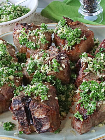 Cooked lamb chops topped with parsley and garlic persillade.