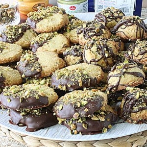 A bunch of Dubai chocolate cookies piled up on a tray.