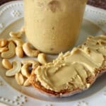 Delicious looking homemade peanut and cashew butter on a crusty slice of bread.