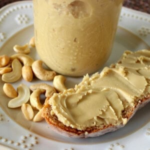 Delicious looking homemade peanut and cashew butter on a crusty slice of bread.