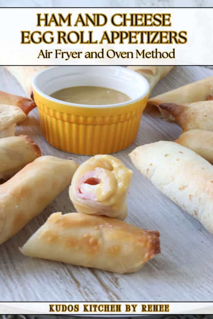A crispy looking ham and cheese egg roll dipped in mustard.