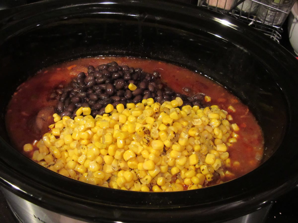Corn and black beans in a slow cooker.