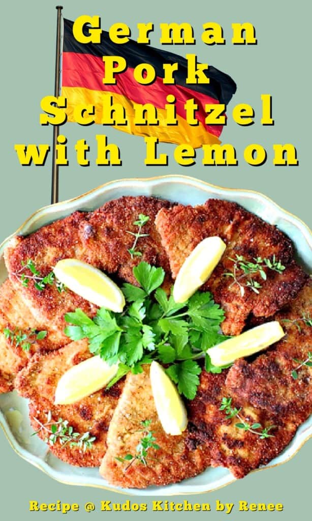 A platter of German pork schnitzel with lemon wedges, parsley, and fresh thyme on top.
