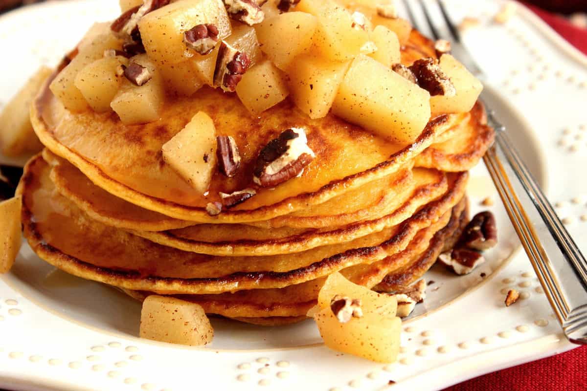 Rosted Sweet Potato and Wild Rice Chowder Cooked, diced apples and chopped pecans on top of a stack of sweet potato pancakes.