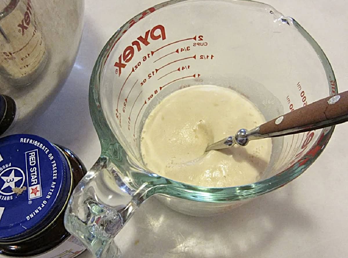 A measuring up with foaming yeast inside.