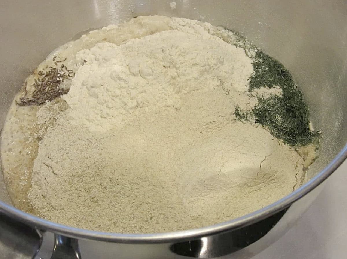 The dry ingredients for making homemade rye bread in a bowl.